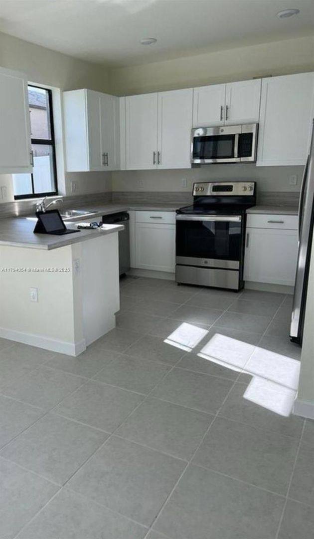 Townhouse for rent at 11101 W 33rd Court, Hialeah, FL 33018