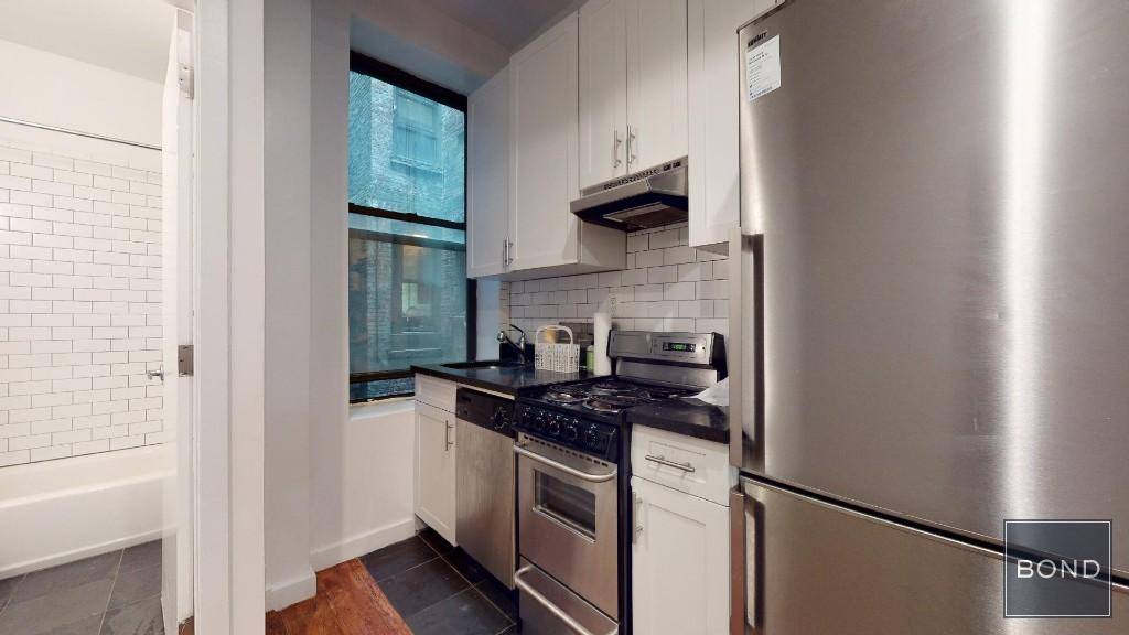 Apartment for rent at 441 W 51 St #1E, New York, NY 10019