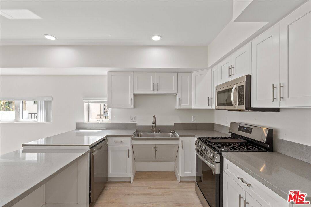 Townhouse for rent at 1409 N Hobart Blvd #104, Los Angeles, CA 90027