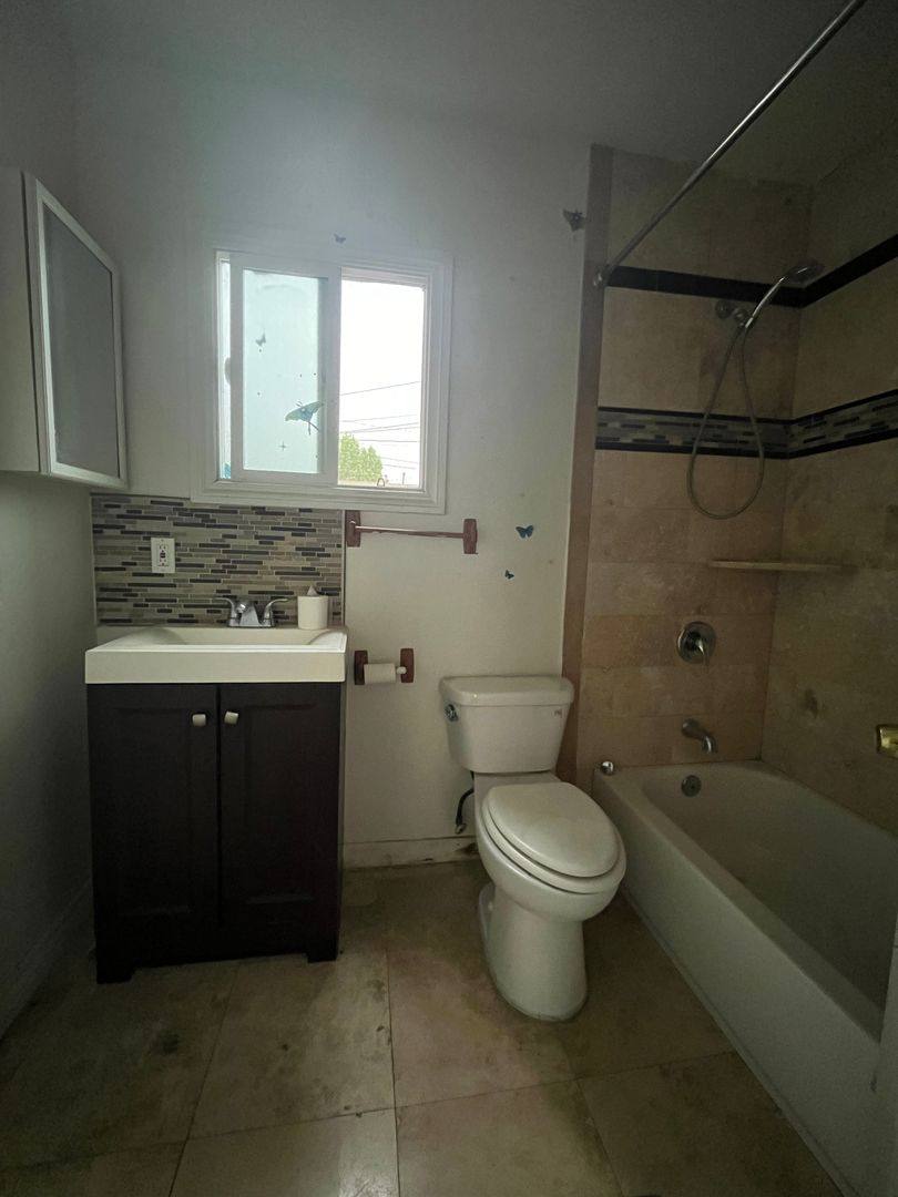 Apartment for rent at 5217 - 5221 1 2 Denker Ave, Los Angeles, CA 90062