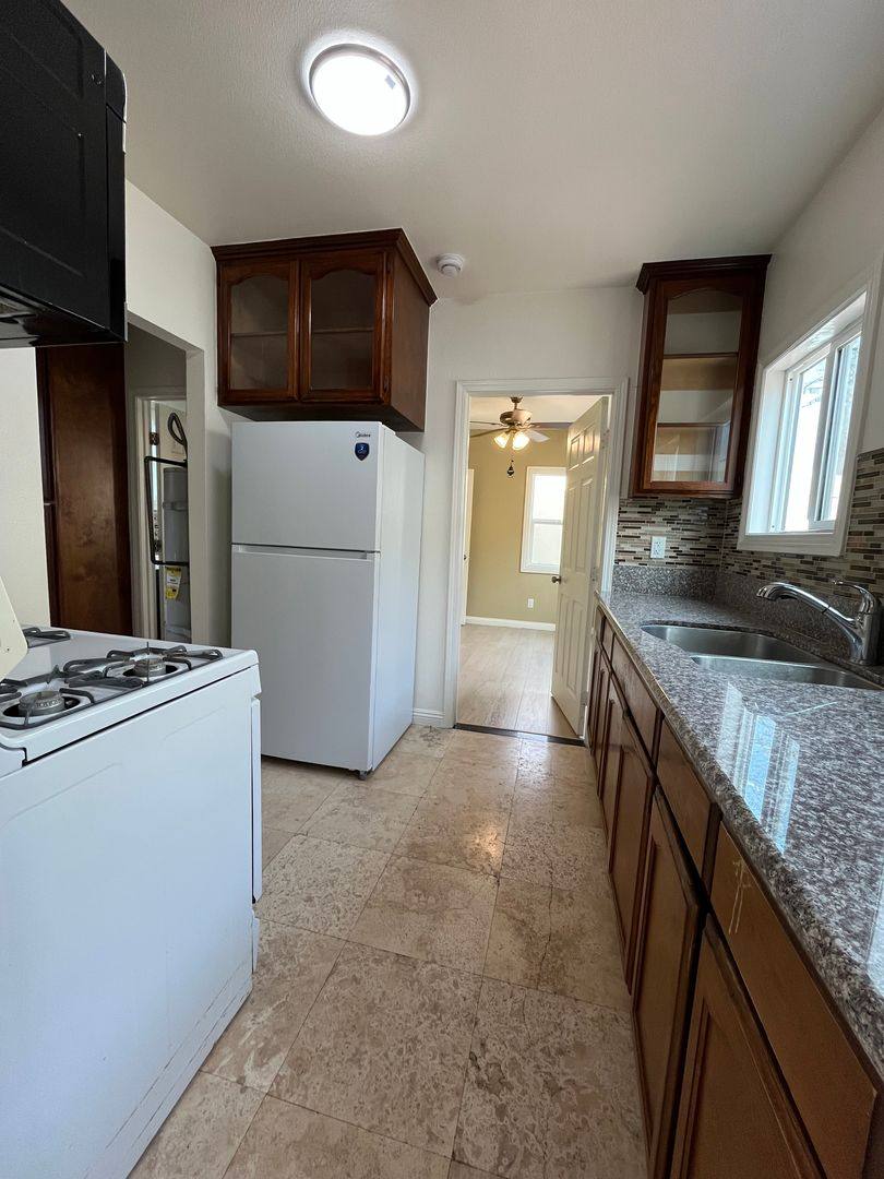Apartment for rent at 5217 - 5221 1 2 Denker Ave, Los Angeles, CA 90062