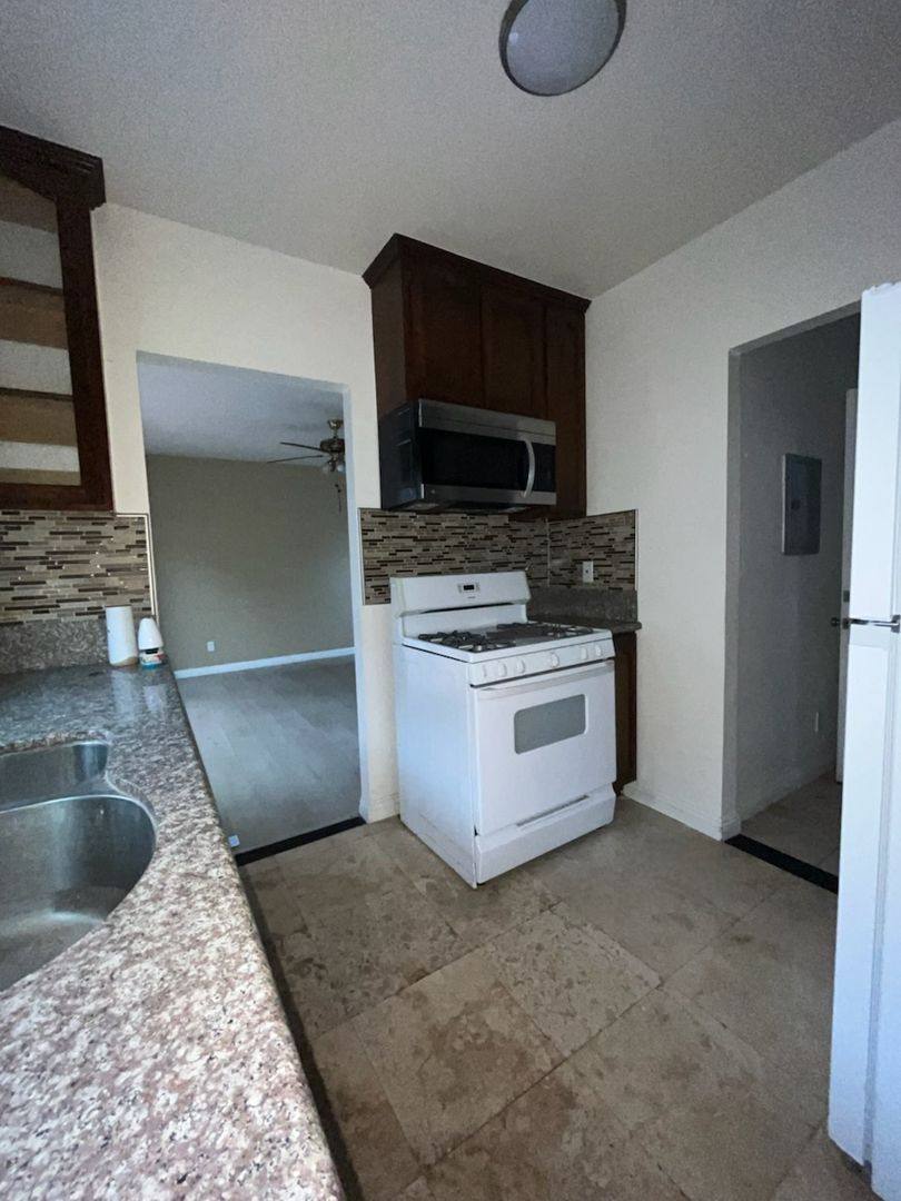 Apartment for rent at 5217 - 5221 1 2 Denker Ave, Los Angeles, CA 90062