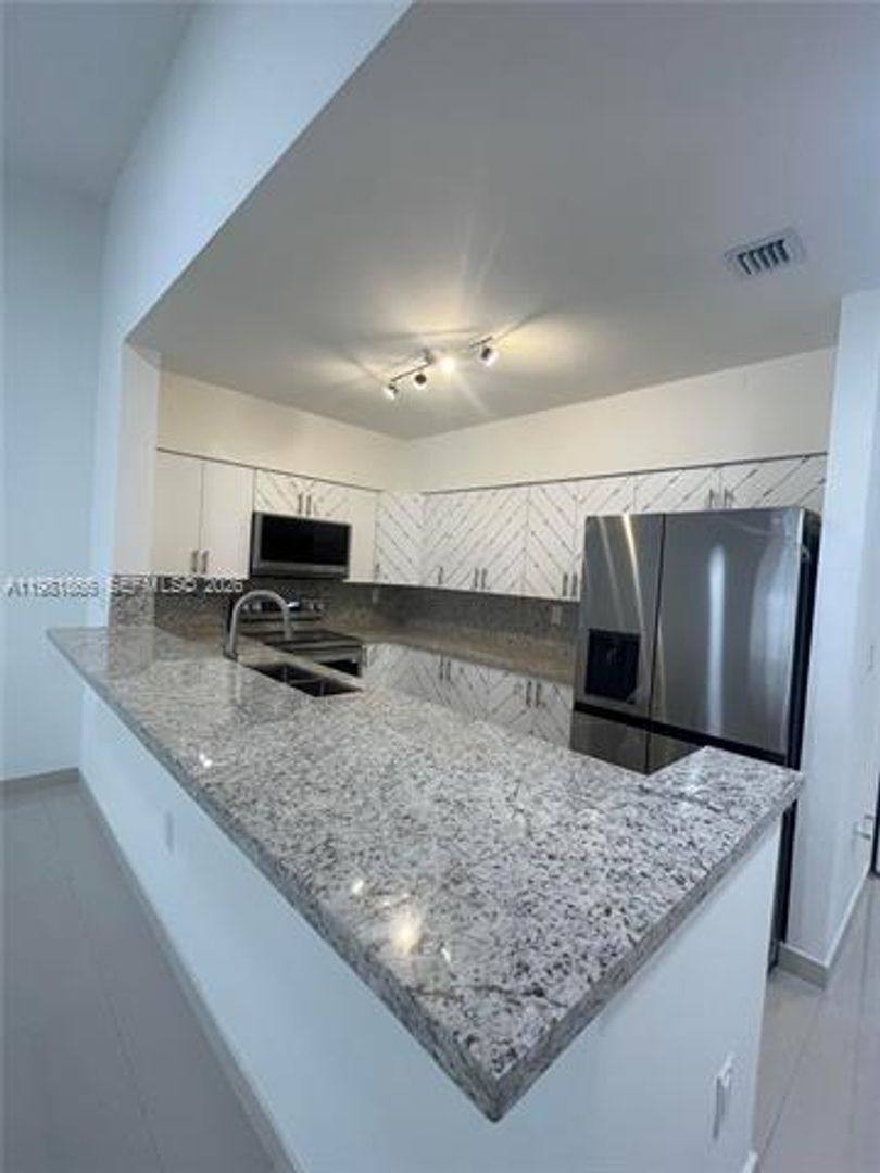Townhouse for rent at 14728 Balgowan Rd Th, Hialeah, FL 33016
